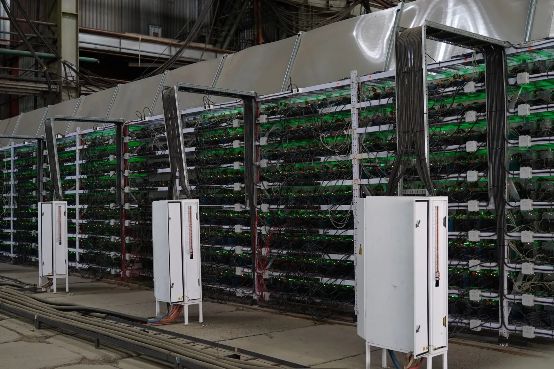 Rows of mining equipment operating inside an industrial facility